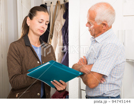 Female collector is trying to get the arrears from mature man at home door Female collector is trying to get the arrears from mature man at home door 94745144