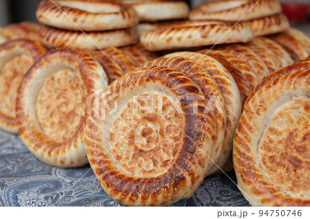 Typical traditional flatbread with crunchy crust with sesam just baked 94750746