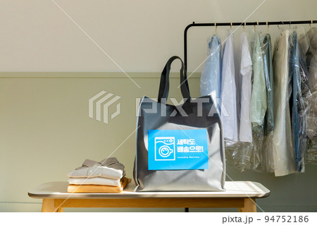 aesthetic laundry concept_laundry bag for pick up service with clothes rack background aesthetic laundry concept_laundry bag for pick up service with clothes rack background 94752186