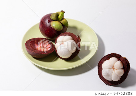 Tropical Fruits_Light green dish and mangosteen Tropical Fruits_Light green dish and mangosteen 94752808