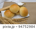 Fresh fragrant bread and bun on the table with copy space. Food concept 94752984