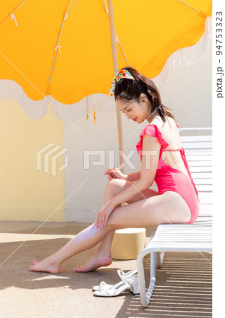 summer vacation concept_korean beautiful asian young woman applying, wearing sunblock summer vacation concept_korean beautiful asian young woman applying, wearing sunblock 94753323