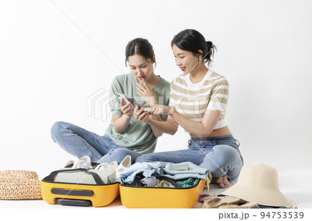 preparing for a summer trip concept series_korean beautiful asian young women watching smartphone 94753539