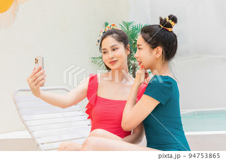 summer vacation trip with friends concept series_korean beautiful asian young women taking a selfie summer vacation trip with friends concept series_korean beautiful asian young women taking a selfie 94753865