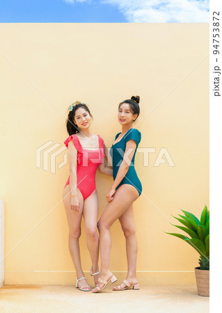 summer vacation trip with friends concept series_korean beautiful asian young women smiling in monokini swimsuits 94753872