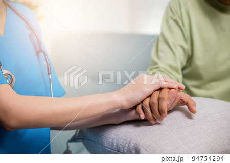 Young woman helping hold hands offering her senior man 94754294