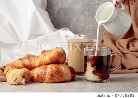 Croissants and coffee with cream. Croissants and coffee with cream. 94756383