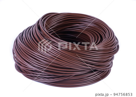 Roll of brown electrical single core cable isolated white background 94756853