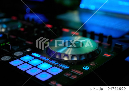 Sound mixer and turntables in night club Sound mixer and turntables in night club 94761099