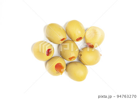 Green olives stuffed with sweet peppers top view, isolated on a white background Green olives stuffed with sweet peppers top view, isolated on a white background 94763270