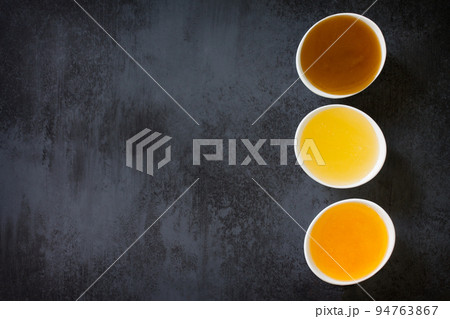 Natural Honey background. Various Honey on black slate background. 94763867