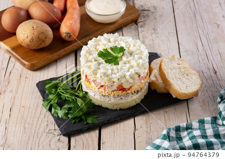 Traditional Russian layered salad Mimosa 94764379