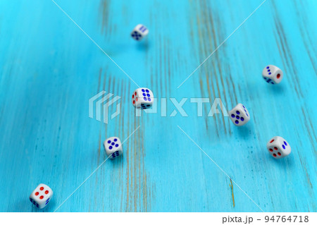 Dice on the blue wooden playing field. Luck and excitement. Concept Board games strategy 94764718