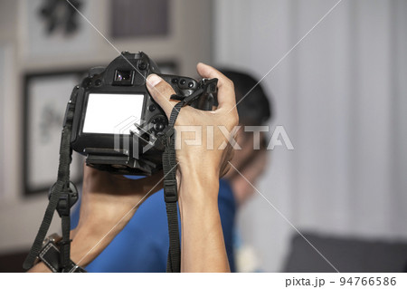 Videographer in the backside of camera are shooing and recording video in Wedding Event. 94766586