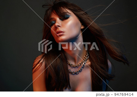 Pretty girl with makeup and steel chain necklace 94769414