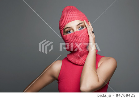 beautiful girl in red balaclava. Trendy red Mask 94769425