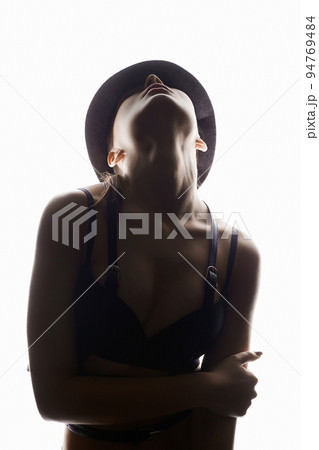 fashion portrait of Beautiful woman in leather belt lingerie and Hat 94769484