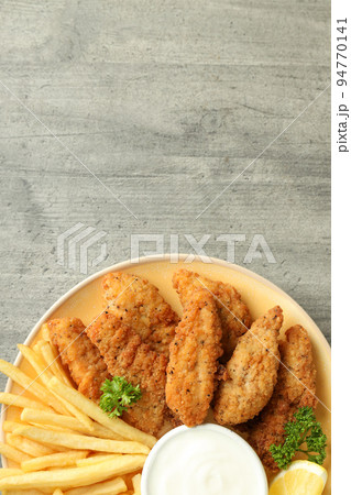Concept of tasty food with chicken strips, space for text Concept of tasty food with chicken strips, space for text 94770141