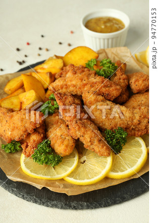 Concept of tasty food with chicken strips, close up 94770153