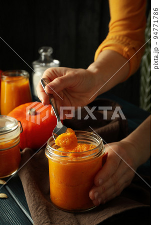 Concept of tasty food with pumpkin jam Concept of tasty food with pumpkin jam 94771786