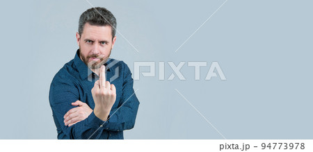 Flipping someone off. Bearded man show middle finger upwards. Obscene hand gesture, fuck you. Man face portrait, banner with copy space. Flipping someone off. Bearded man show middle finger upwards. Obscene hand gesture, fuck you. Man face portrait, banner with copy space. 94773978