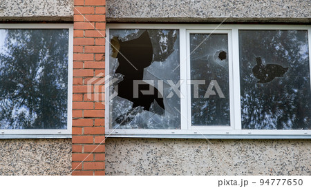 Broken glass in an abandoned house, abstract background Broken glass in an abandoned house, abstract background 94777650