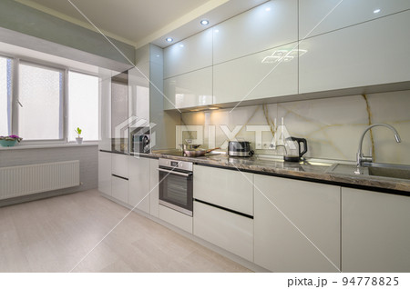 Interior of modern trendy white kitchen Interior of modern trendy white kitchen 94778825