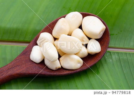 Fresh garlic on green leaf Fresh garlic on green leaf 94779818