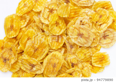 Banana slice chips on white background. 94779890