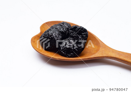 Dried prunes on white background 94780047