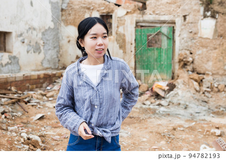 Girl is standing in ruins Girl is standing in ruins 94782193