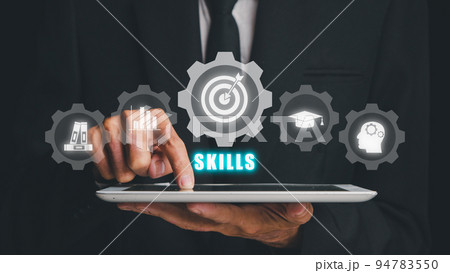 Skill knowledge ability business internet technology concept, Man hand using digital tablet with skills icon on screen display. Skill knowledge ability business internet technology concept, Man hand using digital tablet with skills icon on screen display. 94783550