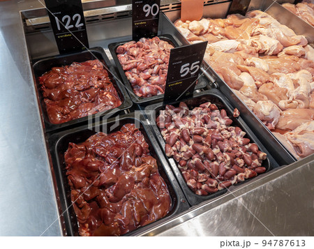Sorted Chicken Internal Organs for Sale at the Butcher's in a Supermarket. 94787613