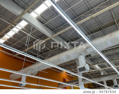 ventilation cooling pipe systems under the ceiling in an industrial building. 94787630