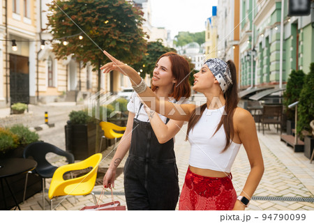 two young women walking outdoor having fun two young women walking outdoor having fun 94790099