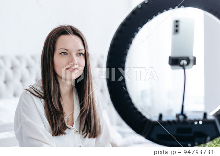 businesswoman is working on a laptop in her bedroom. businesswoman is working on a laptop in her bedroom. 94793731