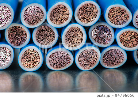 Electric copper cable cross section on metal surface  94796056