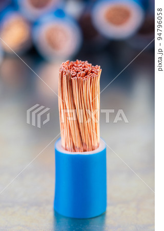 Scrap of Electrical Copper Cable on Metal Surface with Blurred Background 94796058