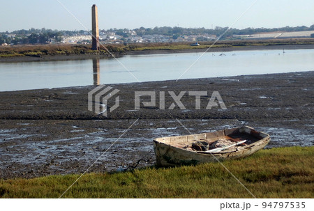 Boat stranded in the mud on the river bank Boat stranded in the mud on the river bank 94797535