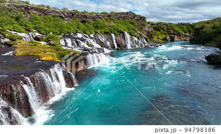 Aerial view of Hraunfossar waterfall in western Iceland, Europe Aerial view of Hraunfossar waterfall in western Iceland, Europe 94798386