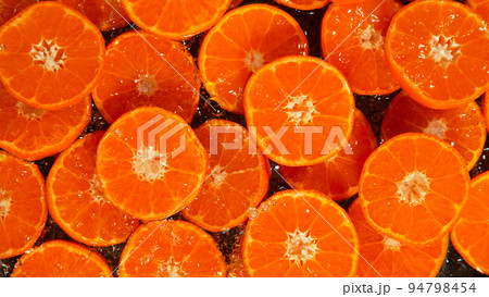 Freeze Motion Shot of Splashing Fresh Tangerines, Close-up. Freeze Motion Shot of Splashing Fresh Tangerines, Close-up. 94798454