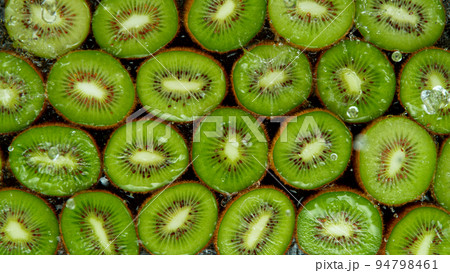 Splashing Fresh Kiwi. Filmed on High Speed Cinematic Camera at 1000fps. 94798461