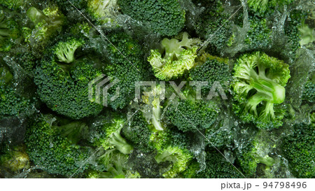 Freeze Motion Shot of Splashing Fresh Broccoli. Filmed on High Speed Cinematic Camera at 1000fps. Freeze Motion Shot of Splashing Fresh Broccoli. Filmed on High Speed Cinematic Camera at 1000fps. 94798496