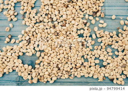 Group of raw coffee beans sunbathing process before roast. 94799414