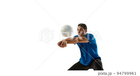 Studio shot of young man, volleyball player playing volleyball isolated on white studio background. Sport, gym, team sport, challenges 94799961