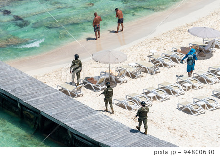 Marina soldiers of Mexican army patrolling beach in Cancun Marina soldiers of Mexican army patrolling beach in Cancun 94800630