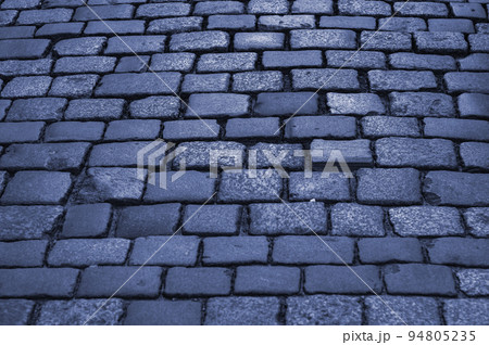 Old pavement. Pavement lined with stone, stone pavement background close-up. Old pavement. Pavement lined with stone, stone pavement background close-up. 94805235