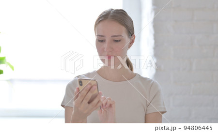 Woman using Smartphone for Browsing Internet Woman using Smartphone for Browsing Internet 94806445
