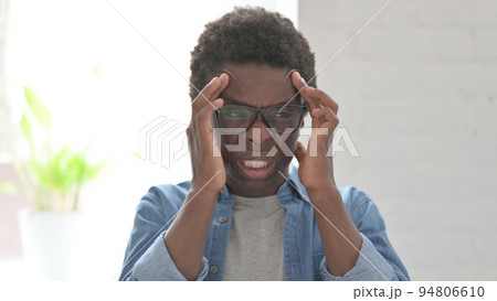 Portrait of Young African Man having Headache 94806610