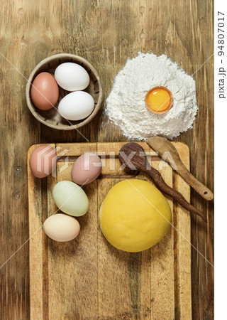Egg noodle dough bun, with ingredients on the table. Egg noodle dough bun, with ingredients on the table. 94807017